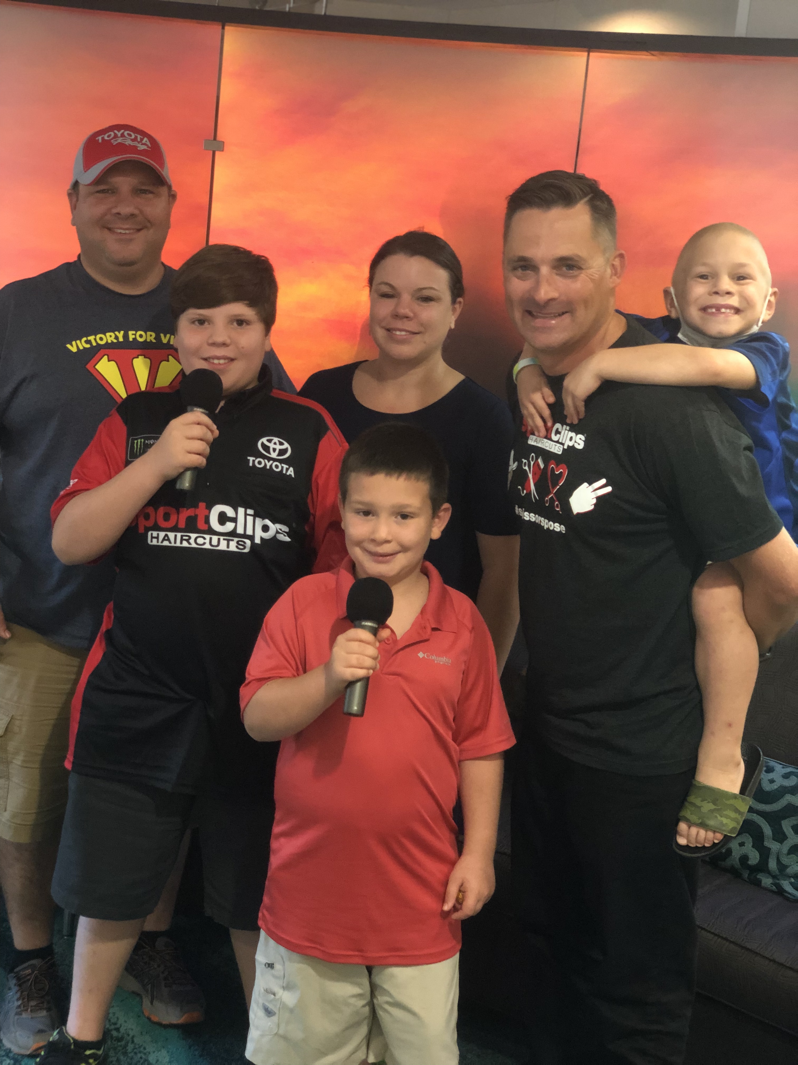 Chad Jordan and Antidormi Family holding a microphone